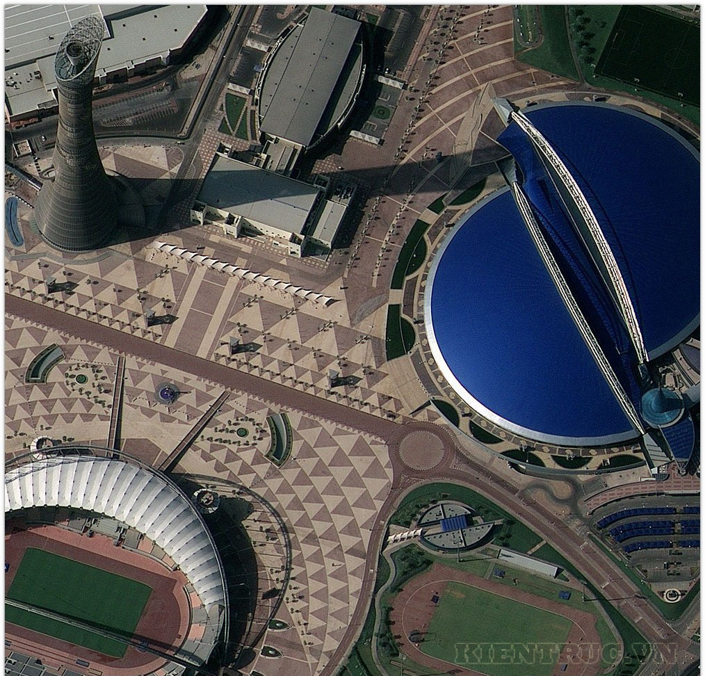 This half-meter resolution image of Khalifa Sports City, Doha, Qatar, was collected by the GeoEye-1 satellite on January 10, 2009. The image shows the 300-meter-tall Aspire Tower, which is the tallest building in Doha; the Khalifa International Stadium surrounded by pavement with intricate patterns; and the blue-domed Hamad Aquatic Centre. This image was taken from 423 miles in space as GeoEye-1 moved from north to south over the Middle East at 17,000 mph.